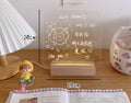 Bedside lamp with LED light showing message board design options and simulation candle night light