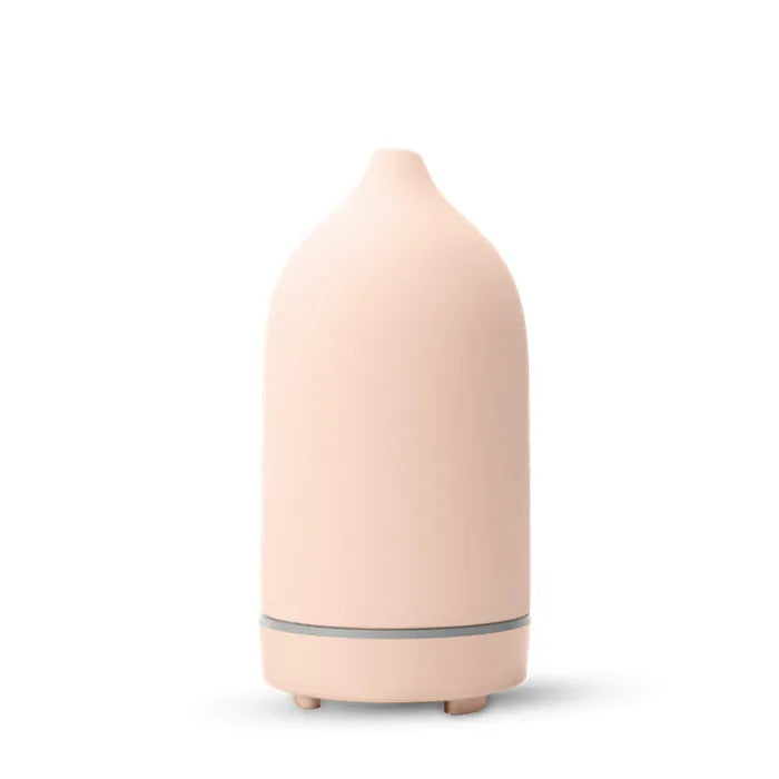 Ceramic aroma diffuser humidifier with 160ml tank, white ceramic finish, single mist outlet, on a wooden table.