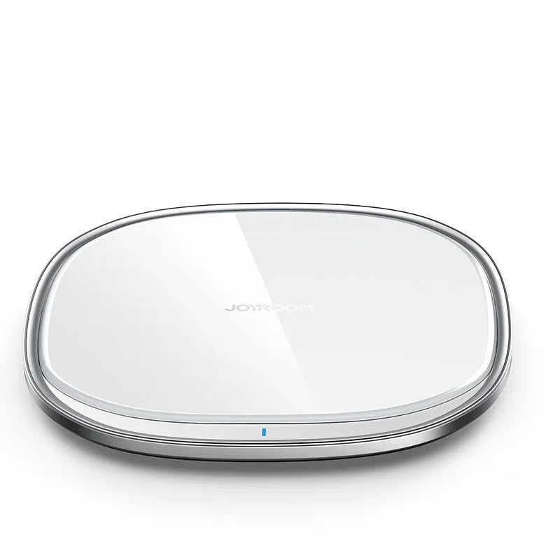 Black or white 15W wireless charger with a glass top and zinc alloy body on a desk.