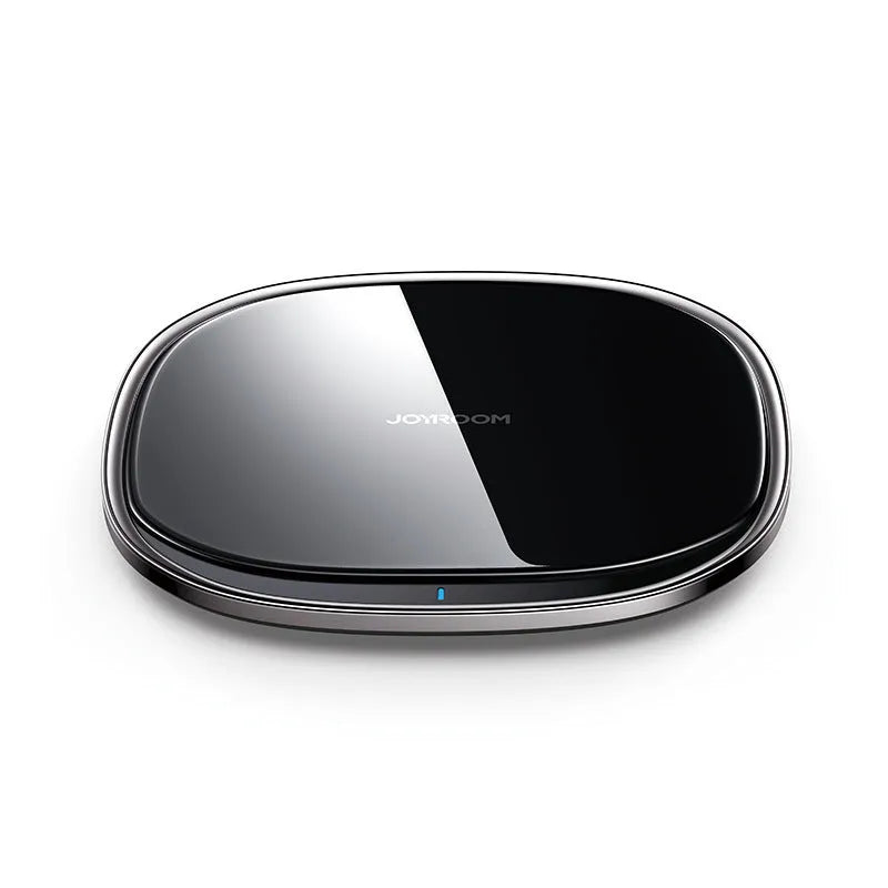 Black or white 15W wireless charger with a glass top and zinc alloy body on a desk.