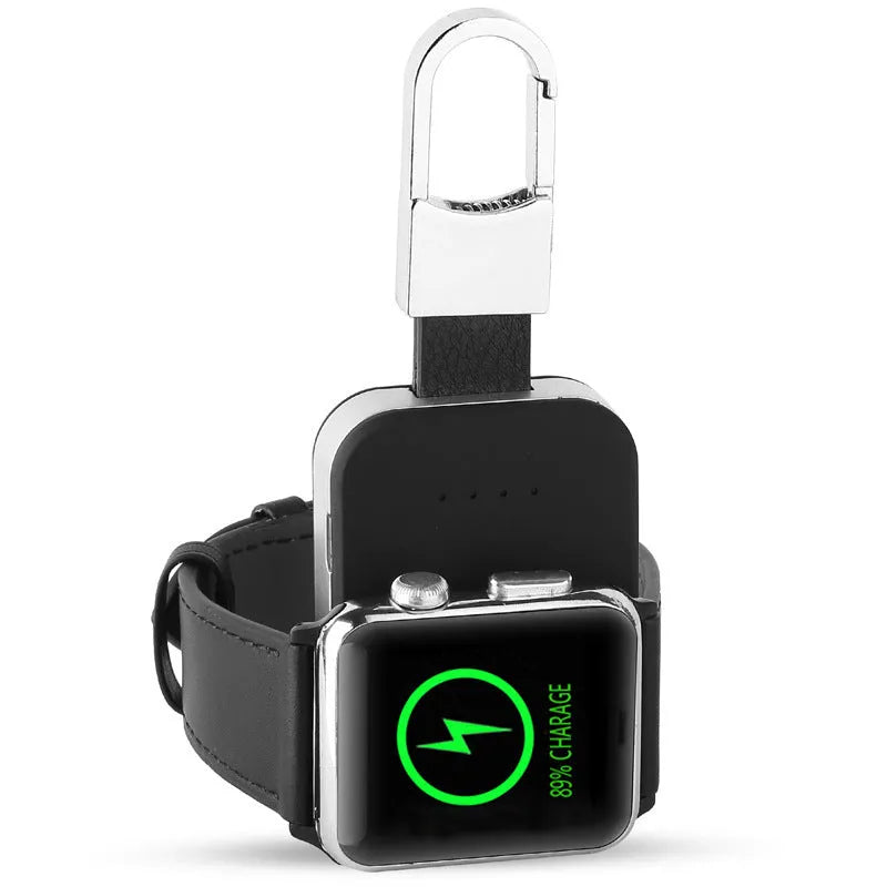 Black Apple Watch wireless charging power bank on a keyring, showing compact size.