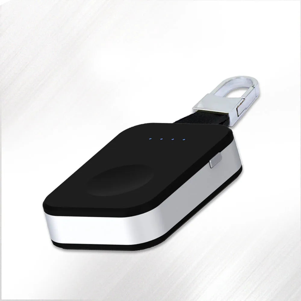 Black Apple Watch wireless charging power bank on a keyring, showing compact size.