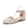 Womens apricot suede ankle strap low heel flats on a white background