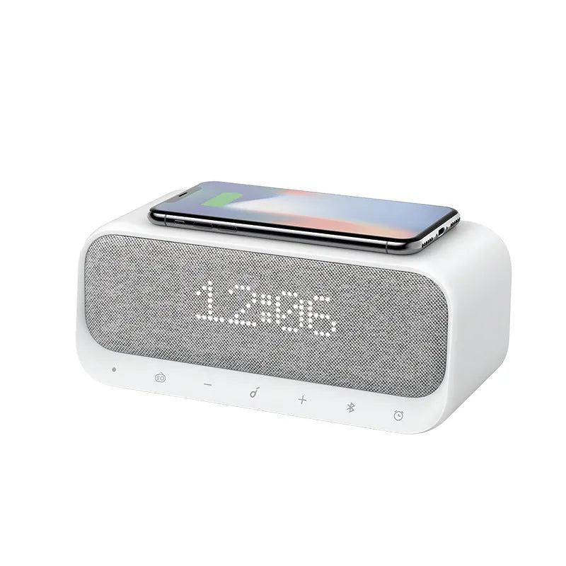 Anker Soundcore white Bluetooth speaker with wireless charging top and digital clock display