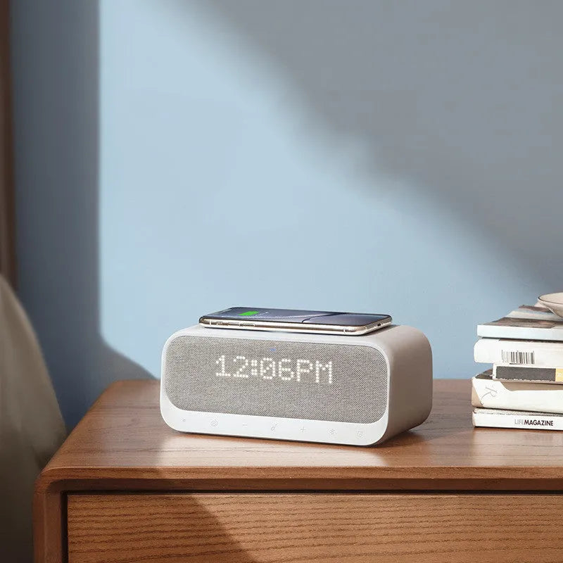 Anker Soundcore white Bluetooth speaker with wireless charging top and digital clock display