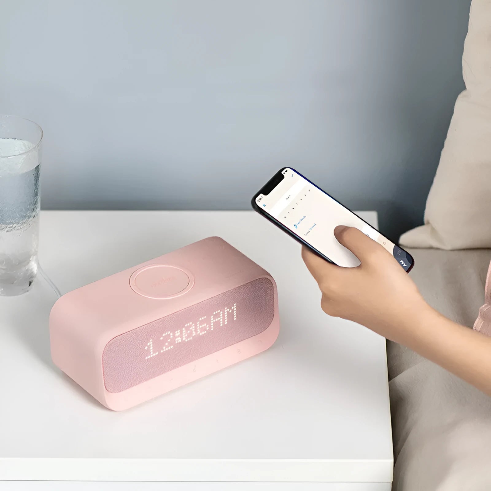 Anker Soundcore white Bluetooth speaker with wireless charging top and digital clock display