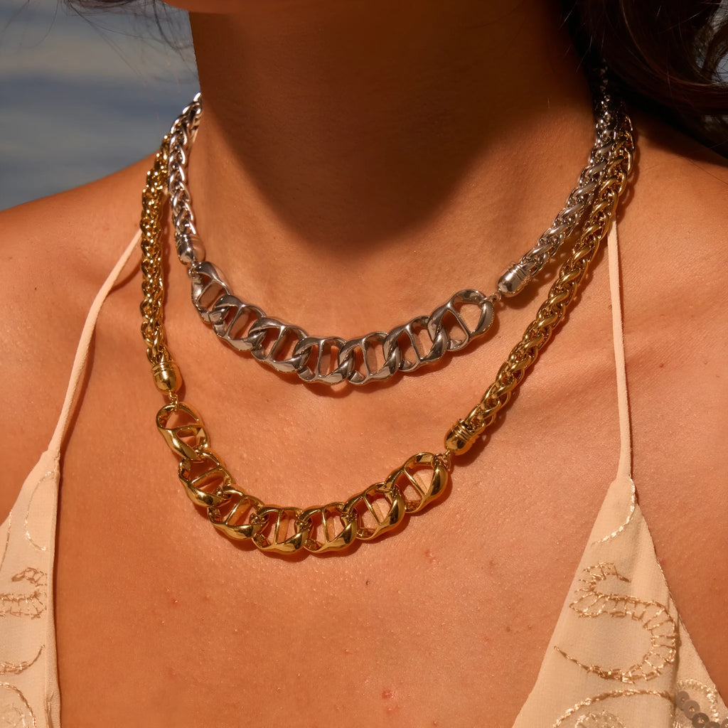Stainless steel geometric pendant necklace with 18K gold plating in gold and steel colour options.