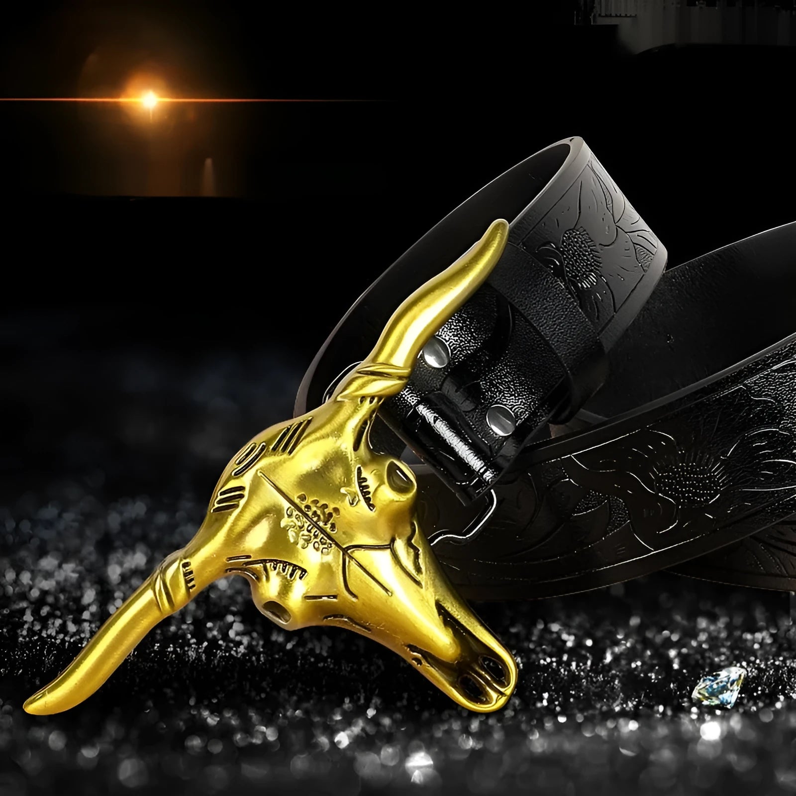 Men's black imitation leather belt with a detailed silver-toned alloy cow head buckle and pin buckle fastening.