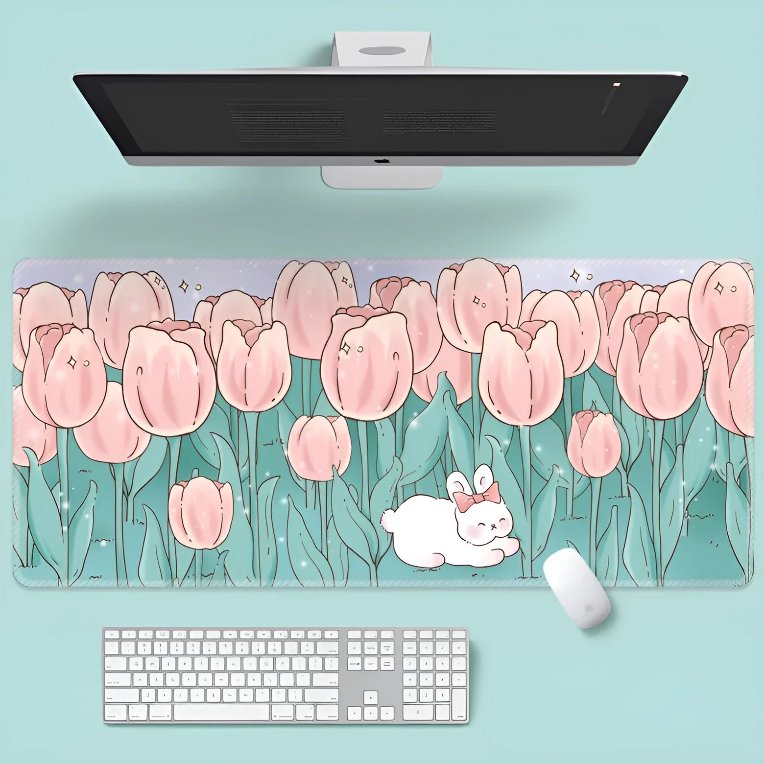 Large colourful cartoon flower pattern mouse pad on a desk with keyboard.