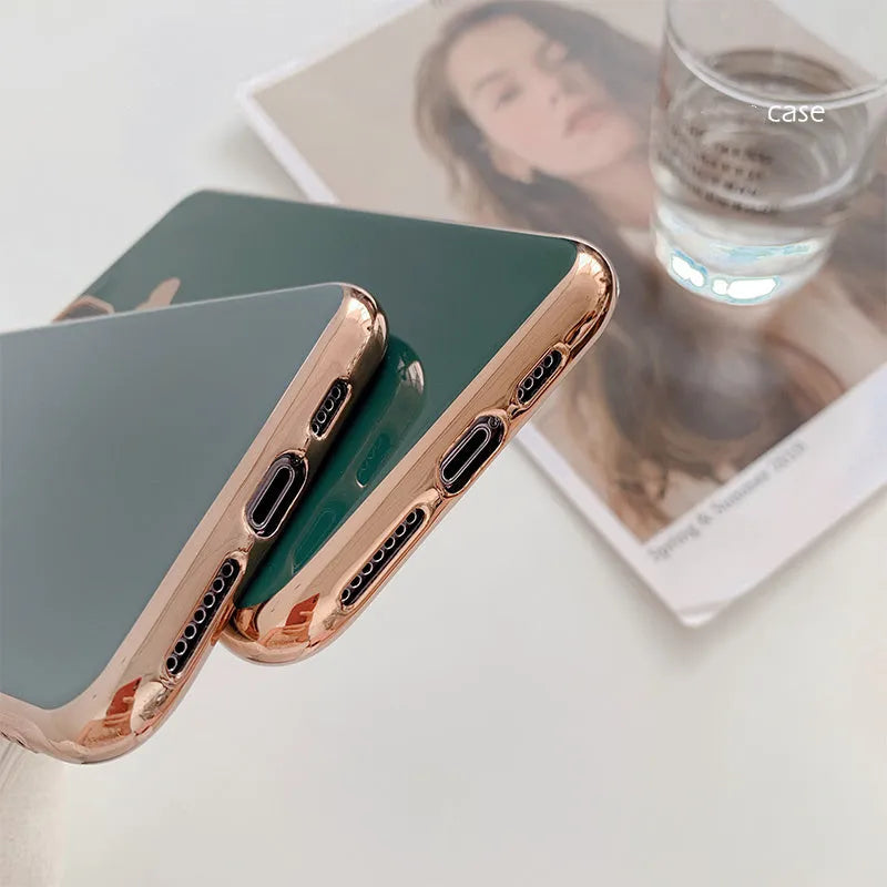 Clear solid colour TPU back cover case for iPhone on a table, shown in blue.