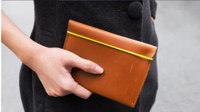Silicone card holder showing open design with card storage positions in green grey colour