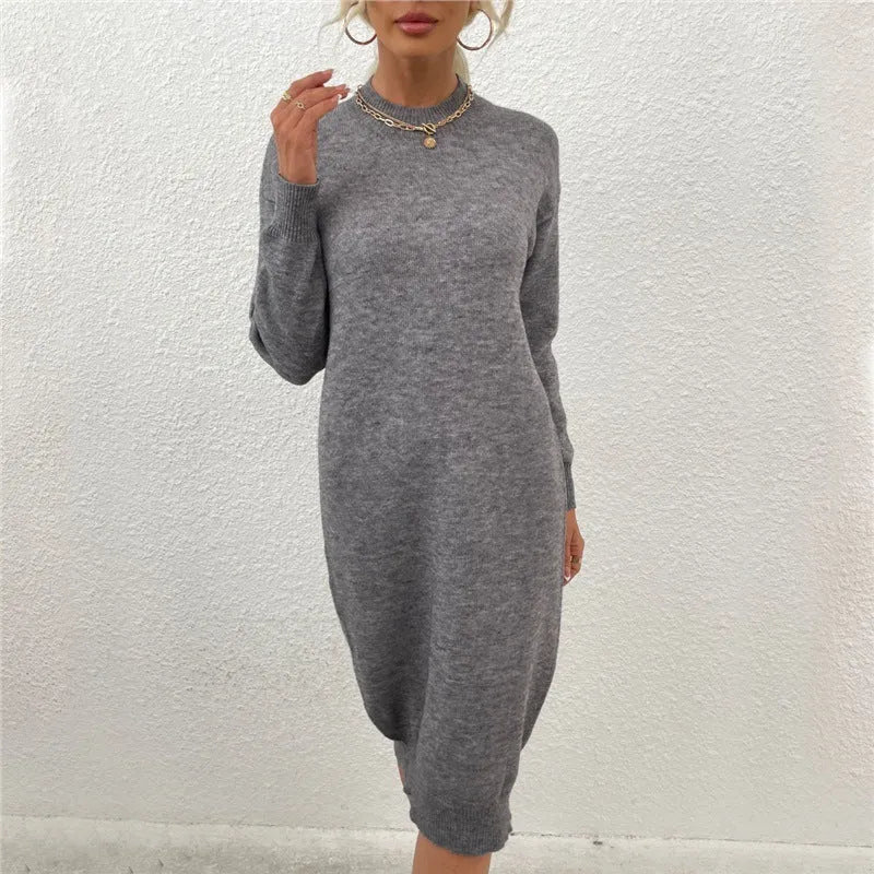 Grey women's acrylic crew neck pullover sweater with long sleeves laid flat.