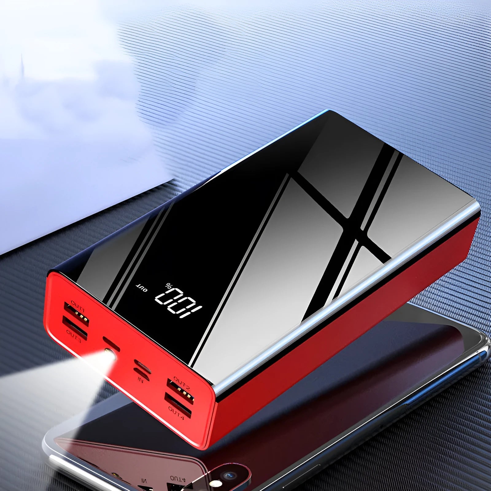 Large black and red 40000mAh power bank showing LCD screen displaying battery percentage.