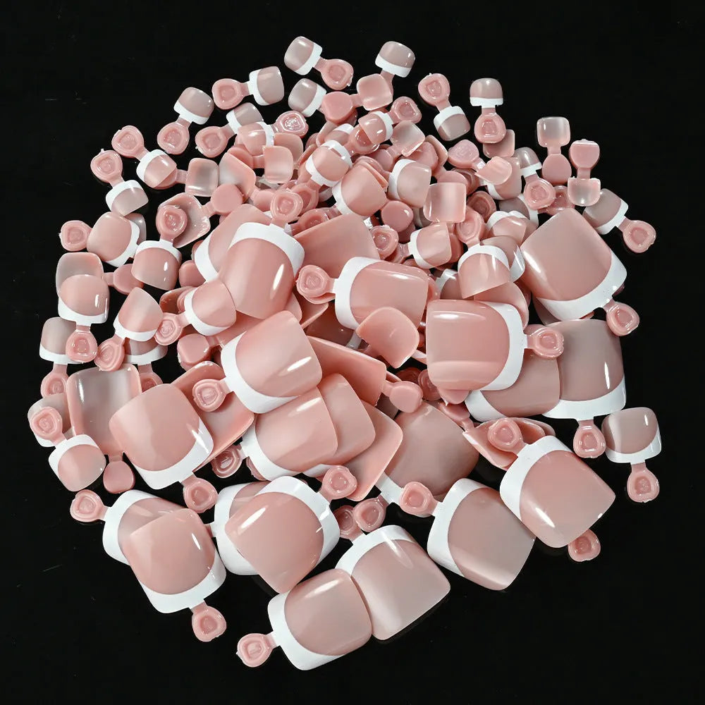 Box of 120 French white edge artificial toenails in square short shape, showing nine nude colour shades.
