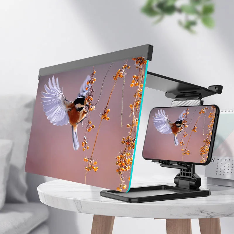 Black folding mobile phone screen amplifier with detachable phone holder on desktop