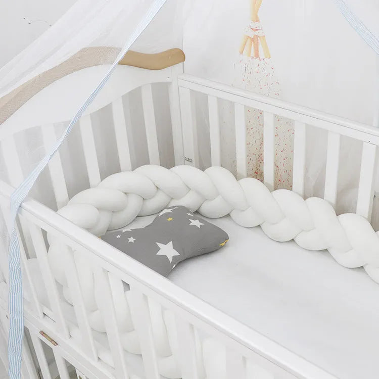 Braided knot baby crib bumper pillow in spandex velvet showing bendable design and colour options.