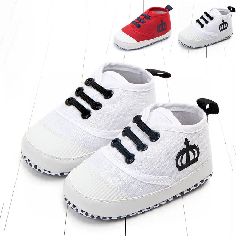 Canvas toddler shoes with elastic band in red and white on neutral background
