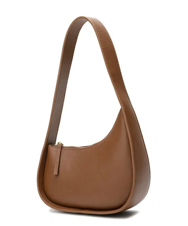 Small brown leather crescent shaped women's shoulder bag with wide strap