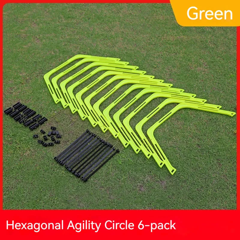 Set of six brightly coloured foldable hexagon football agility training rings on grass