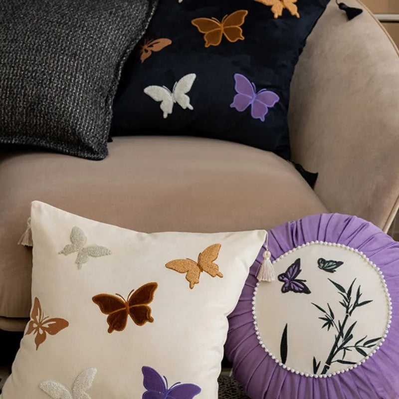 Square cushion with Chinese style butterfly embroidery in beige, black, and purple colours