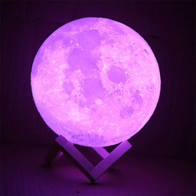 3D printed moon lamp on wooden stand with touch control ring at base, showing white and yellow light colours.