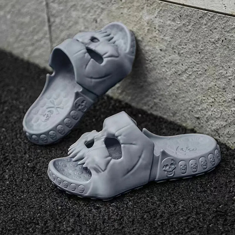 Khaki personalised skull design EVA slippers on a tiled floor, unisex Halloween flip-flops for indoor outdoor use