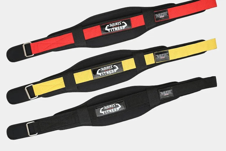 Black nylon fitness weightlifting belt on a gym floor, showing adjustable buckle and supportive width.