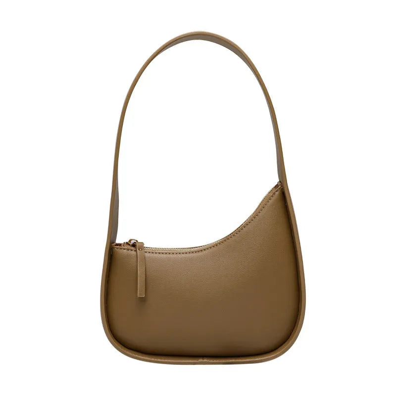 Small brown leather crescent shaped women's shoulder bag with wide strap