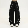 Black pleated wide-leg trousers with striped pattern for hip hop dance and streetwear