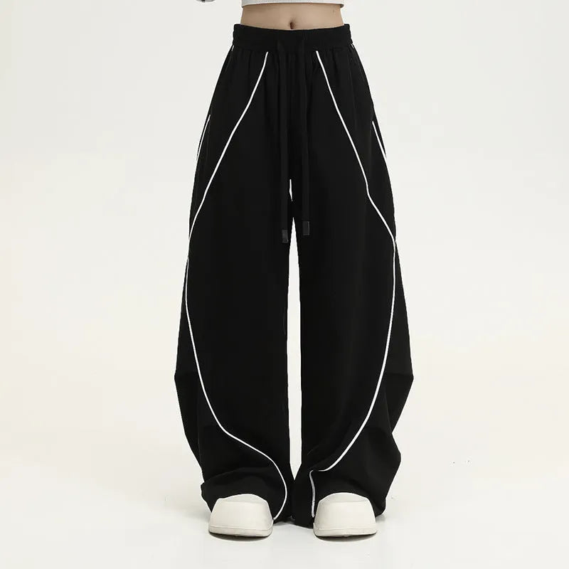 Black pleated wide-leg trousers with striped pattern for hip hop dance and streetwear