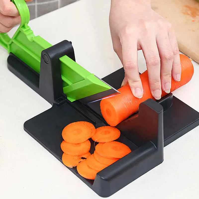 Green and red vegetable cutter with stainless steel blades for slicing carrots and potatoes