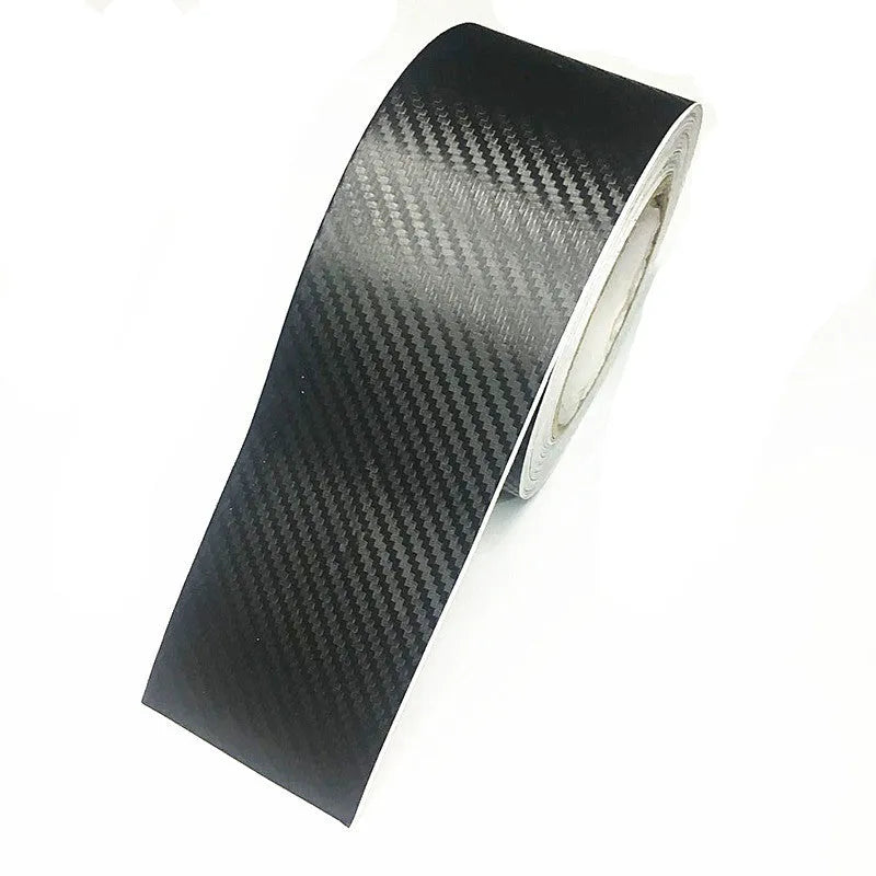 Matte carbon fibre pattern adhesive protection roll for car door sills and bumpers.