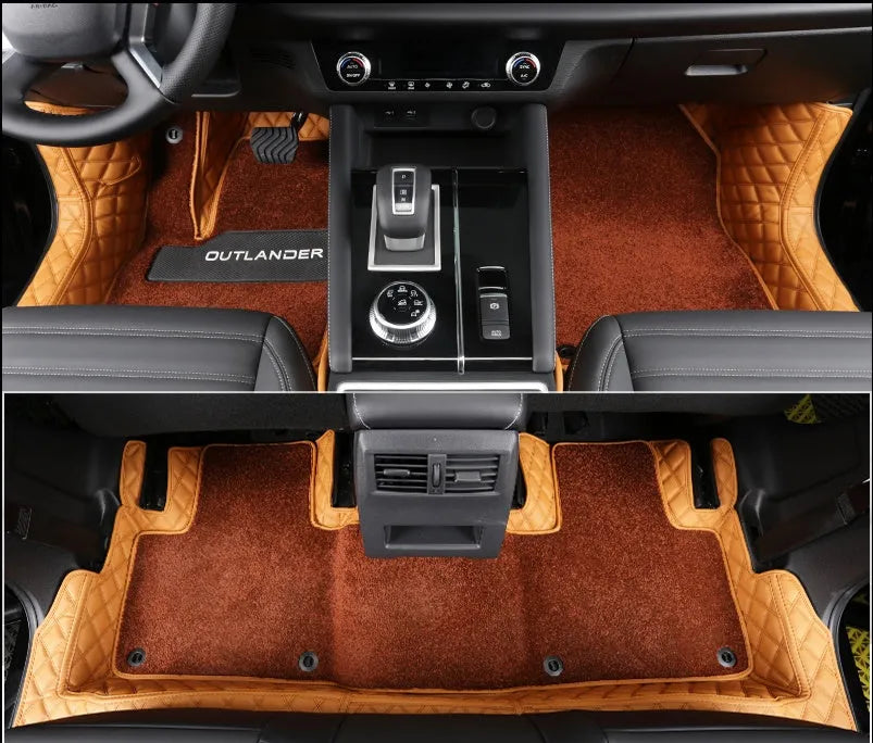 Custom black floor mats installed in a Mitsubishi Outlander footwell.