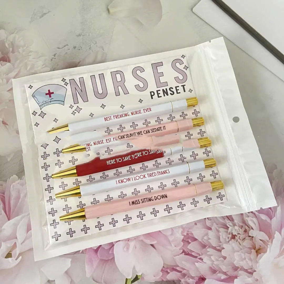Five nurse theme ballpoint pens with retractable mechanisms and medical humour text