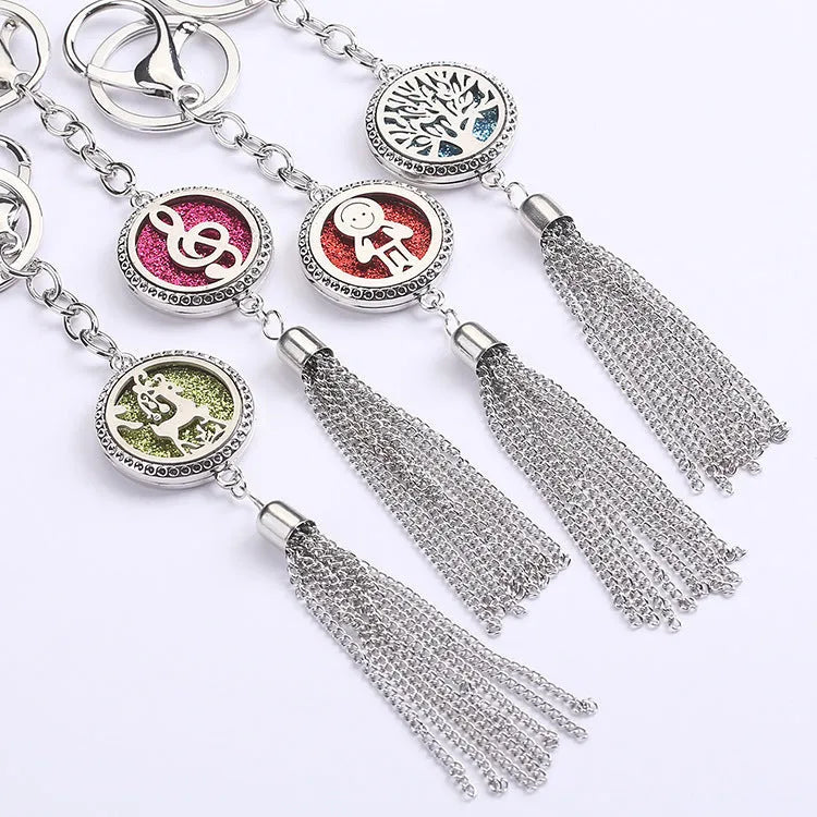 Alloy tassel-style car fragrance pendant with cotton pads hanging from rear-view mirror