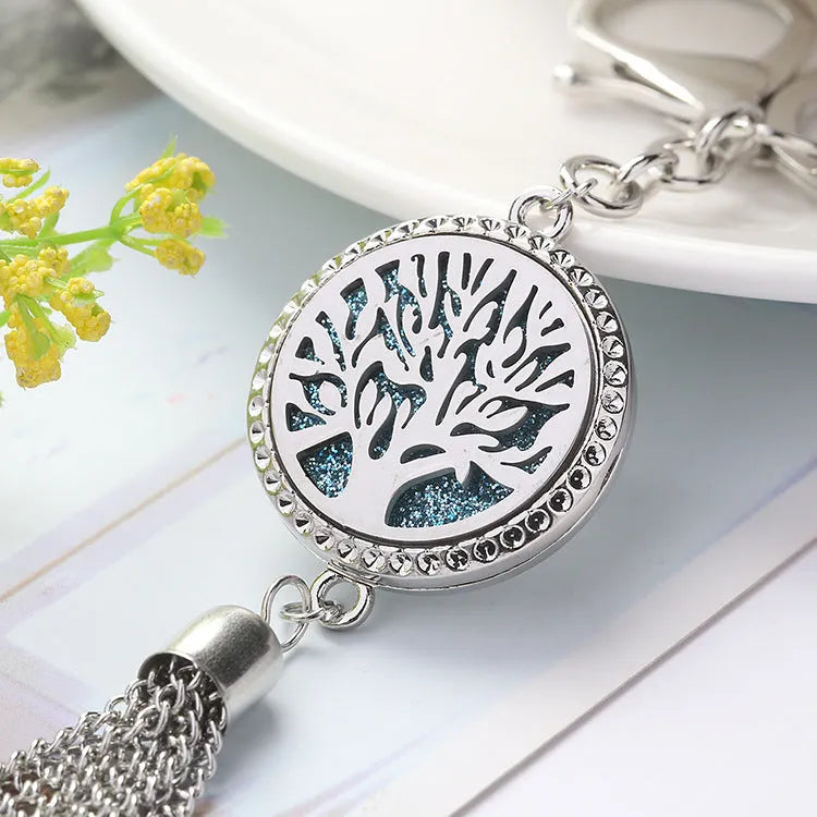 Alloy tassel-style car fragrance pendant with cotton pads hanging from rear-view mirror