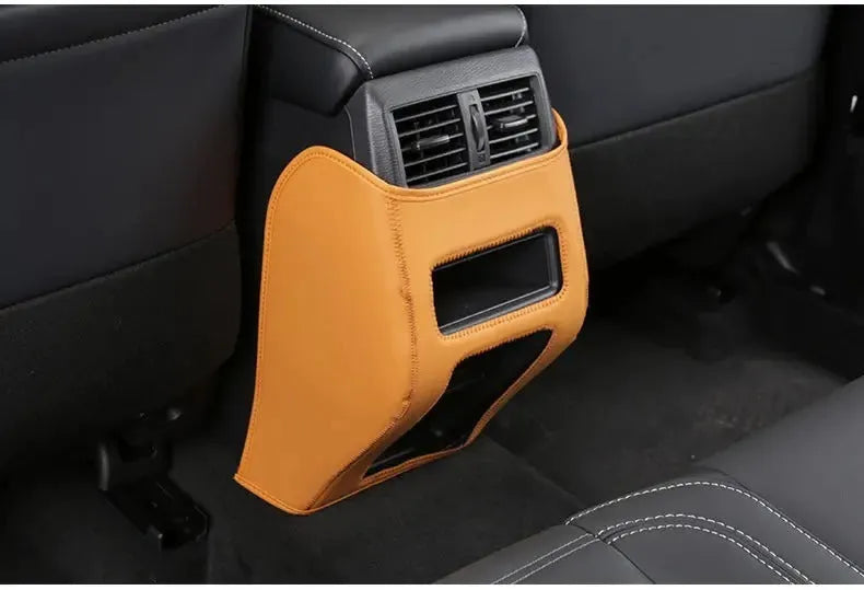 Set of three leather anti-kick pads for 2023 Mitsubishi Outlander car seats.