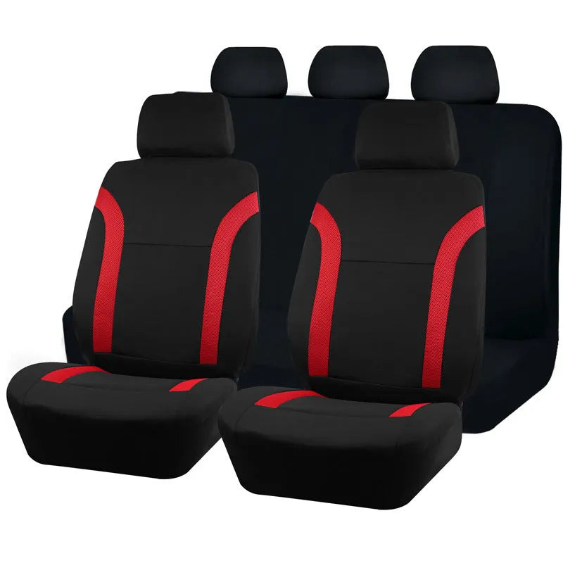 Set of blue polyester car seat covers with eyelet stitching on a vehicle seat.