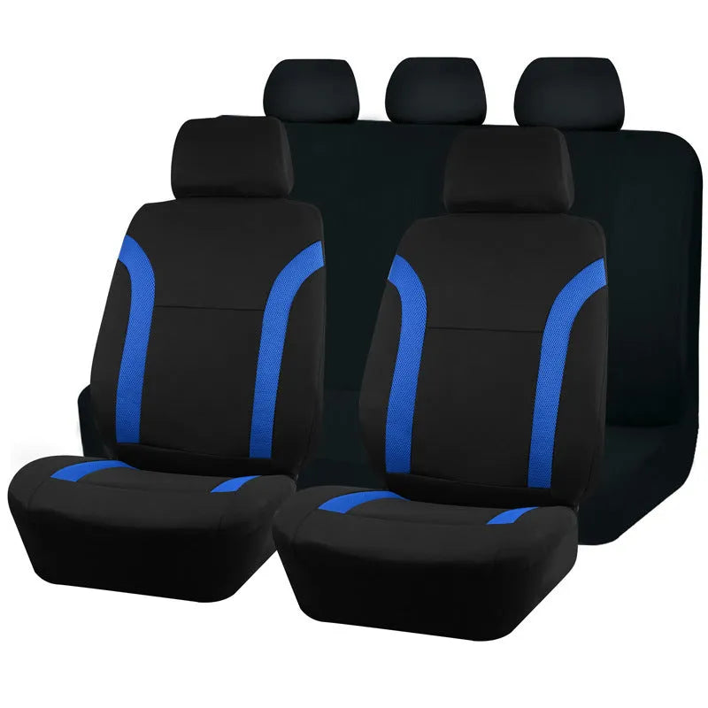 Set of blue polyester car seat covers with eyelet stitching on a vehicle seat.