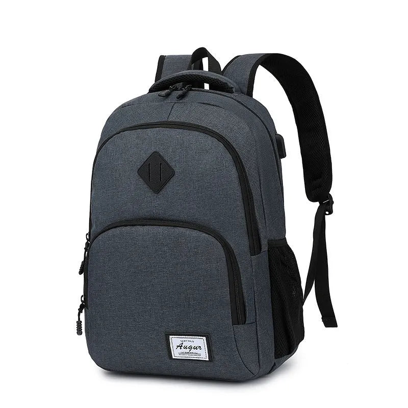 Grey nylon backpack with USB charging port and trolley strap on luggage