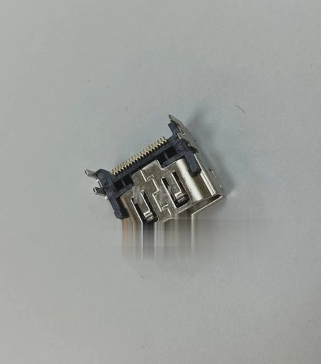 Silver HDMI host interface socket adapter for gaming console connectivity