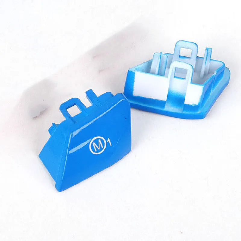 Pair of red and blue BMW steering wheel M1 M2 mode button accessories made from ABS plastic.