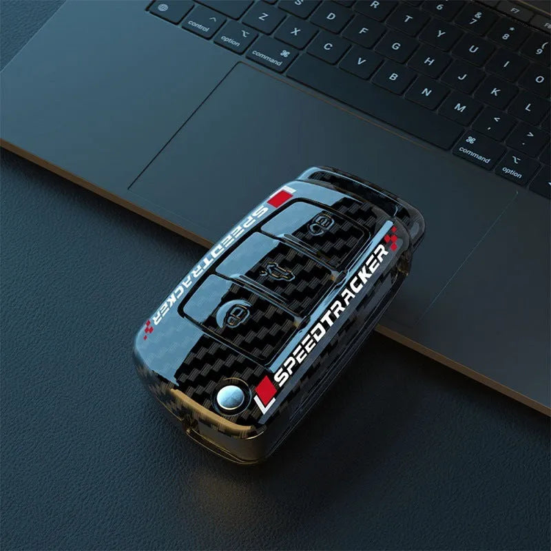 Carbon fibre style car key cover with a small mirror, shown in black and white colour options.