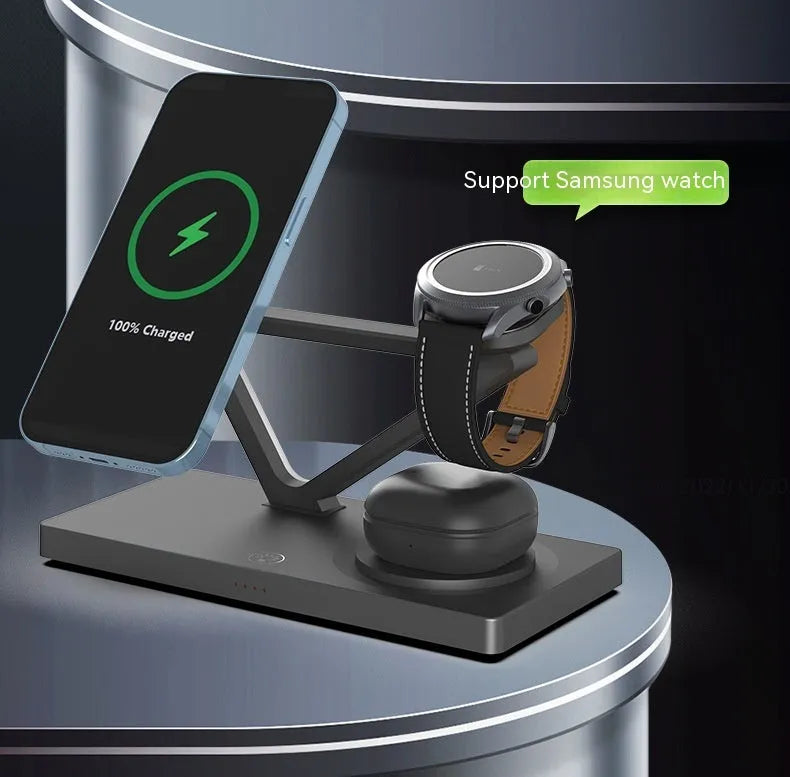 White five-in-one wireless charging station with magnetic phone bracket, circular pad, and watch dock, showing a night light glow.