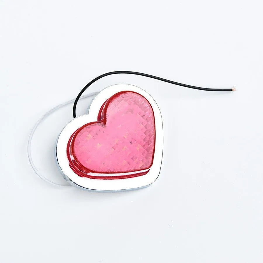 12V heart-shaped red LED automotive sidelight for fender mounting on a car.