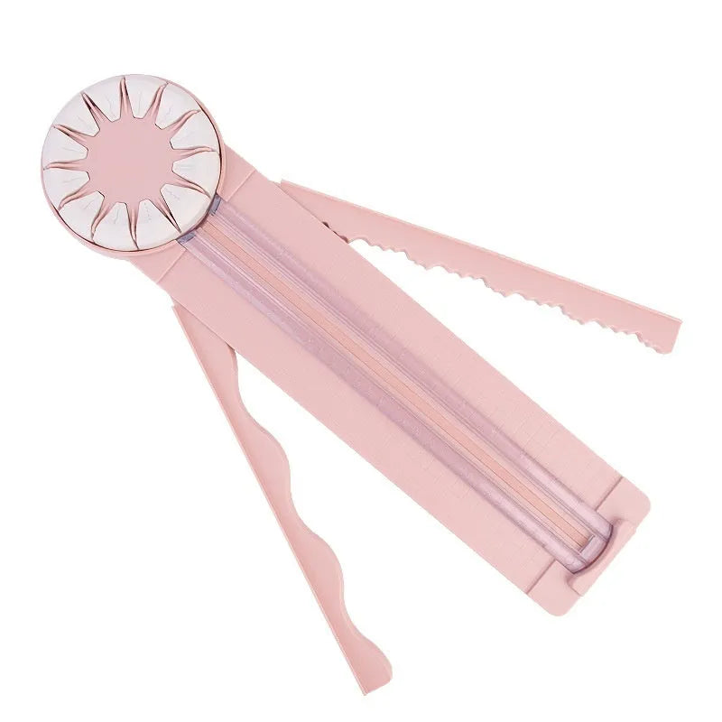 Pink 12-in-1 multifunctional paper cutting machine with plastic construction measuring 46.2cm wide