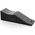 Black rectangular car seat protector pad on a vehicle seat, showing its thick construction and size.