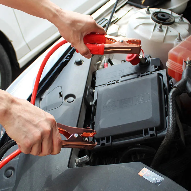 Black and red car battery jump leads with metal clip holders on a 2-metre cable.