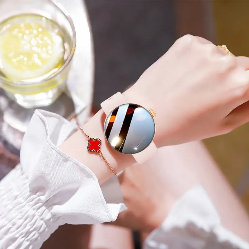 Circular smart watch for women with metal strap, showing colour touch screen display.