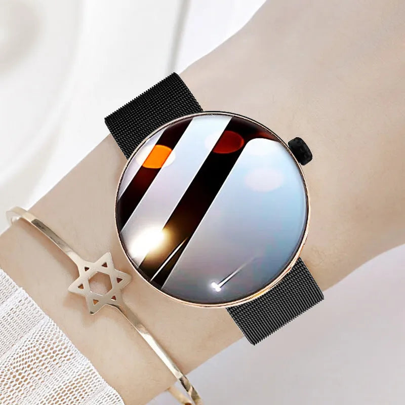 Circular smart watch for women with metal strap, showing colour touch screen display.